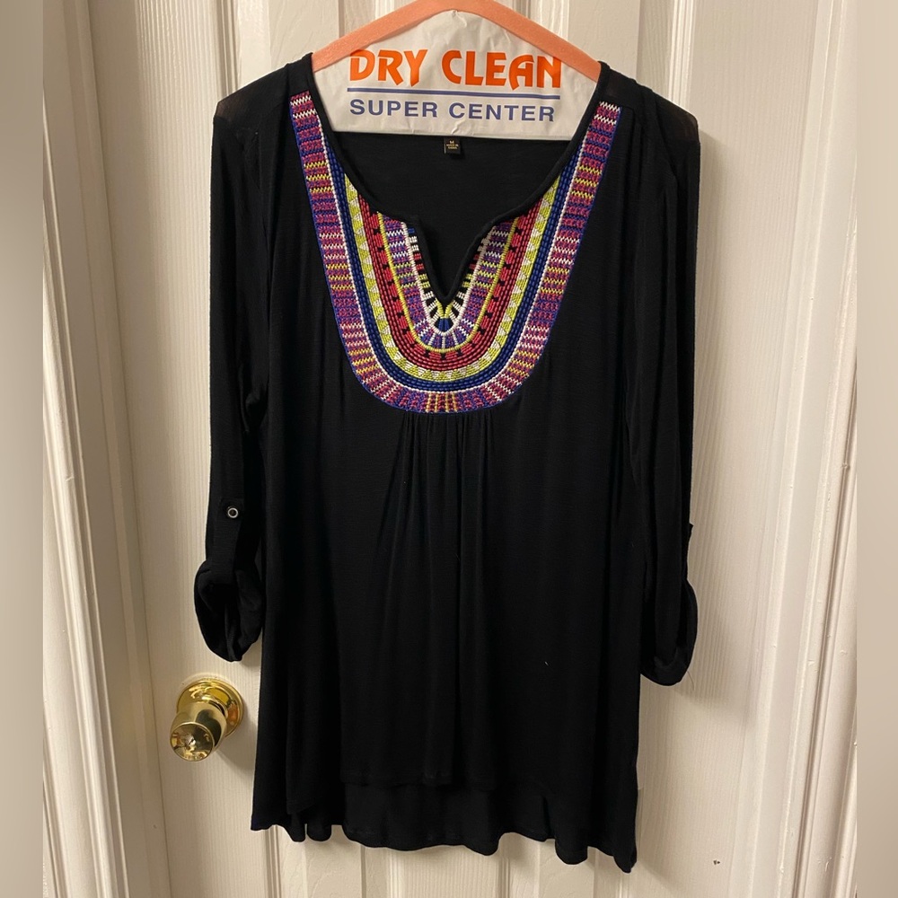 Black v-neck shirt. Long sleeve that can rolled to 3/4 length.